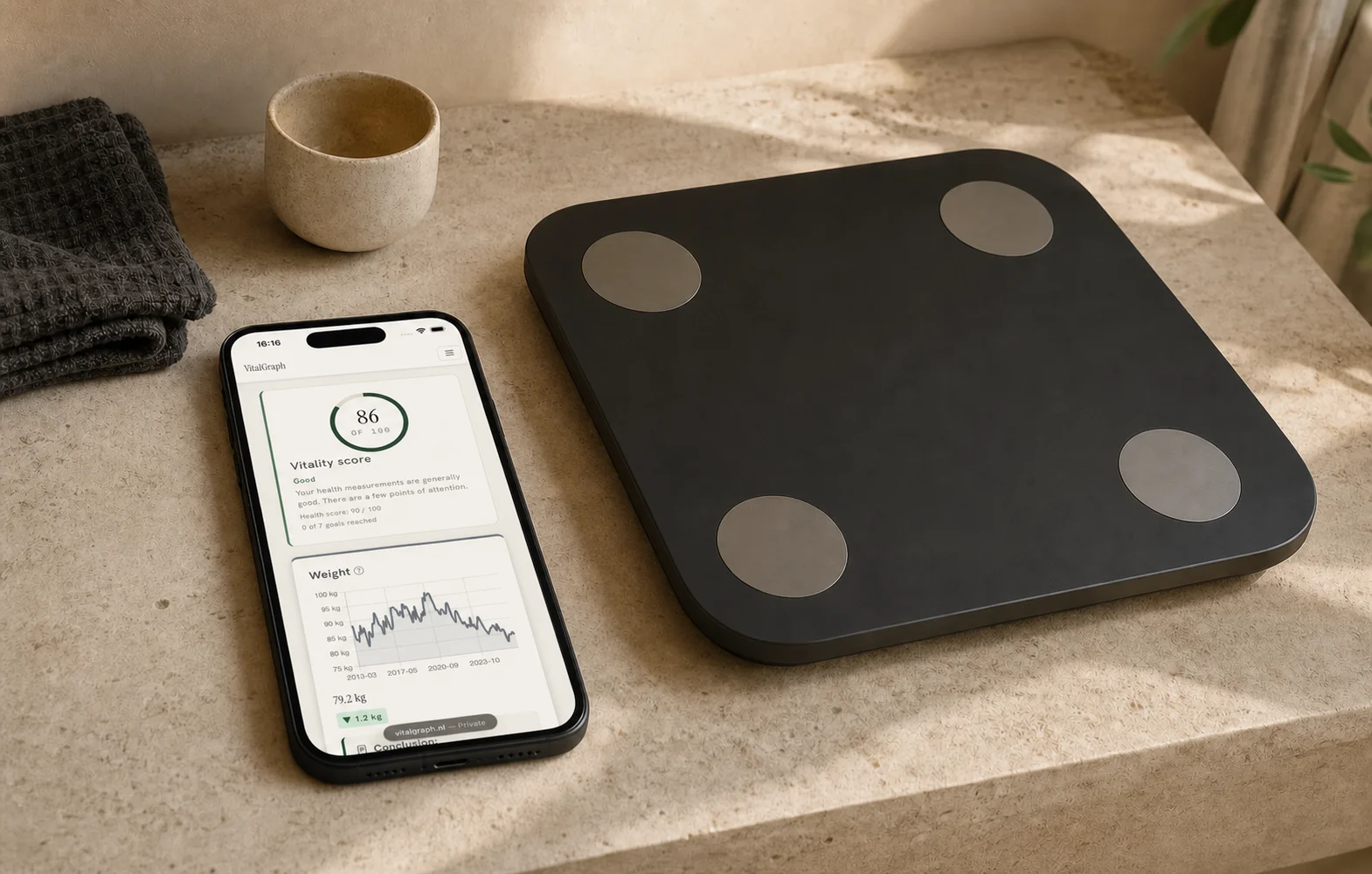 photo: VitalGraph on a phone beside a scale